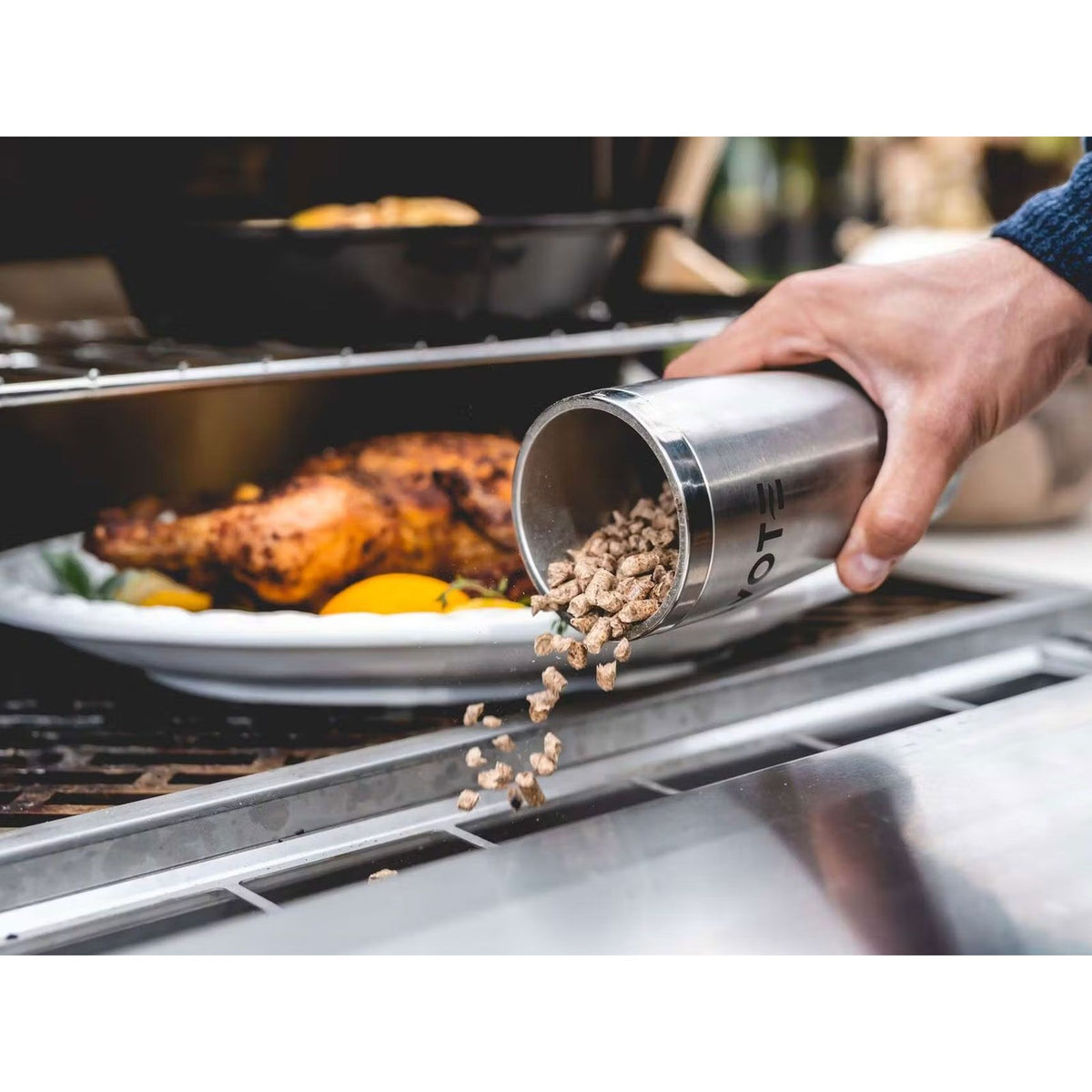 Coyote C2P36 36-inch stainless steel pellet grill with digital control panel and built-in design for outdoor cooking.