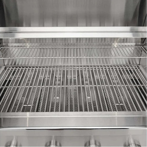 Coyote C3CL36 36-inch stainless steel built-in gas grill with four burners and side shelves for outdoor cooking.