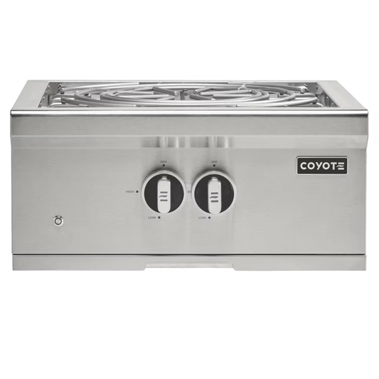 Coyote C3PB 24-inch built-in outdoor stainless steel power burner module with lid removed, showing burners and controls.